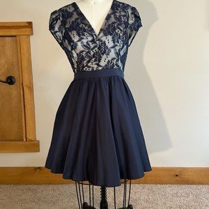 Mini dress in navy with cream under lace